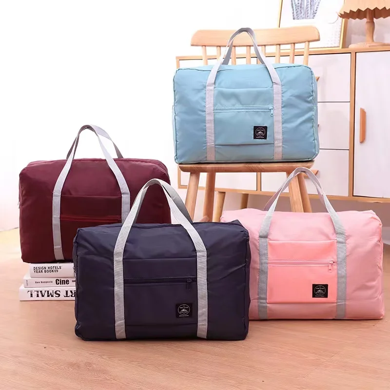 Travel Accessories Organiser - กระเป๋าเดินทางพับได้ไนลอนขนาดใหญ่ความจุกระเป๋ากันน้ํากระเป๋าถือผู้หญิงกระเป๋าเดินทางผู้ชายเสื้อผ้าบรรจุภัณฑ์ Organizer